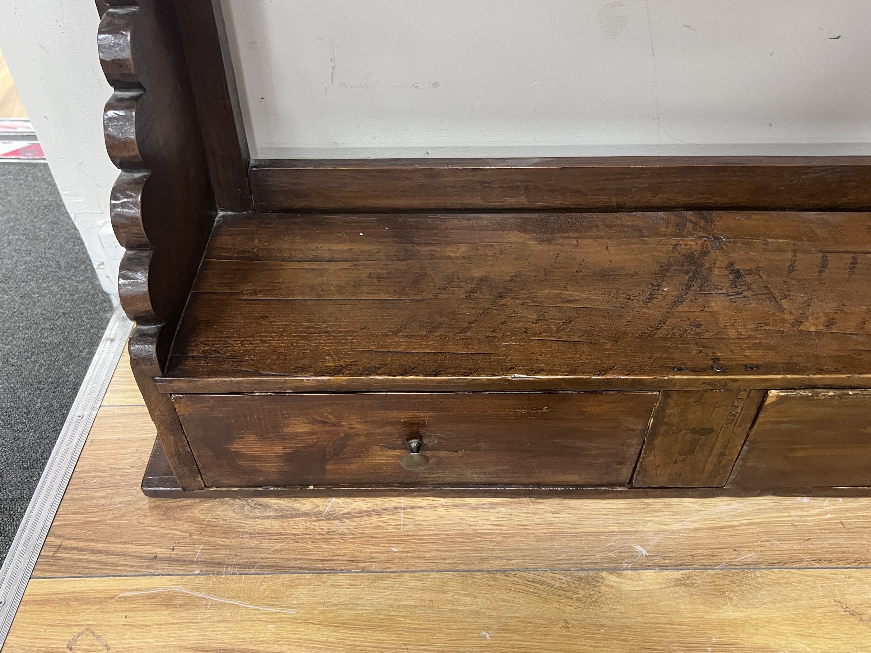 A provincial pine four tier hanging wall bracket, width 85cm, depth 21cm, height 102cm